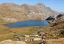 Scenic view of Lac Mézan surrounded by mountains in Provence-Alpes-Côte d'Azur, France.