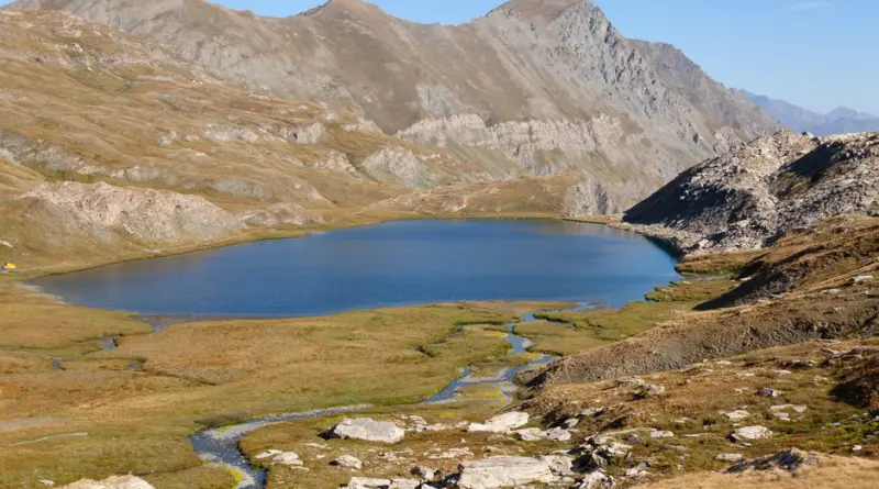 Scenic view of Lac Mézan surrounded by mountains in Provence-Alpes-Côte d'Azur, France.