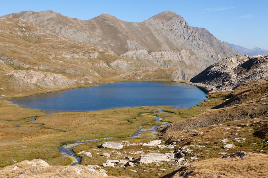 Scenic view of Lac Mézan surrounded by mountains in Provence-Alpes-Côte d'Azur, France.